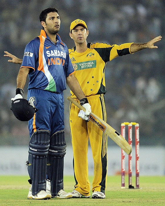 Australia captain Ricky Ponting gestures to India's Yuvraj Singh as they look towards the spectators’ stands during the fourth ODI match at Mohali on Tuesday. (AFP) Australia bounce back against India