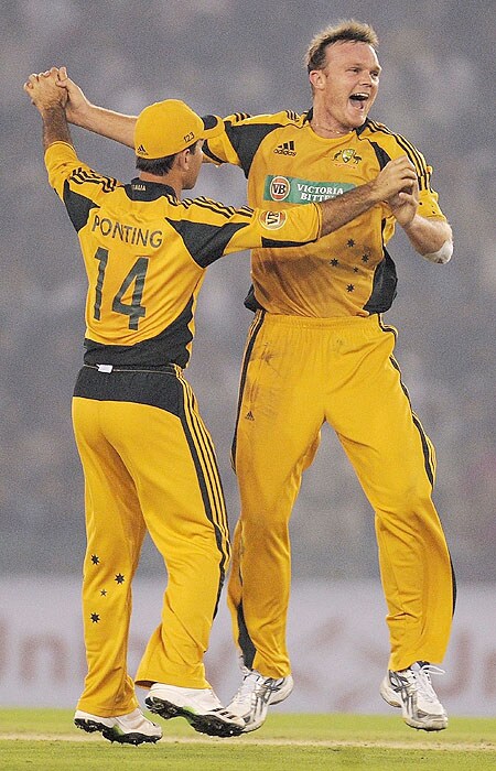 Australia's Doug Bollinger celebrates with captain Ricky Ponting after taking the wicket of India's Virender Sehwag during the fourth ODI match at Mohali on Tuesday. (AFP Photo) Australia bounce back against India