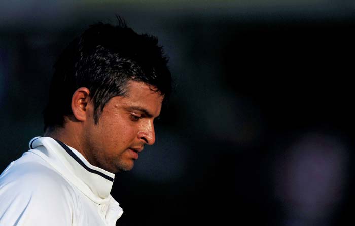 Suresh Raina walks back to the dressing room after losing his wicket during the third day of the first Test between India and Australia in Mohali. (AFP Photo) IND vs AUS: 1st Test, Day 3