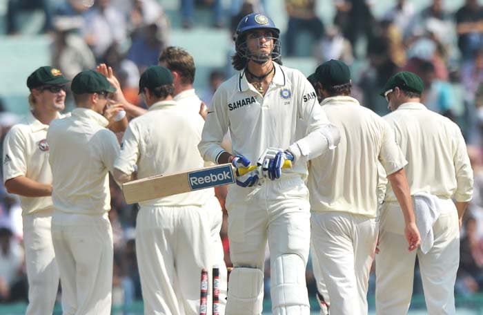 Ishant Sharma walks back to the dressing room after he was out as Australian cricketers celebrate his wicket during the third day of the opening Test between India and Australia in Mohali. (AFP Photo) IND vs AUS: 1st Test, Day 3