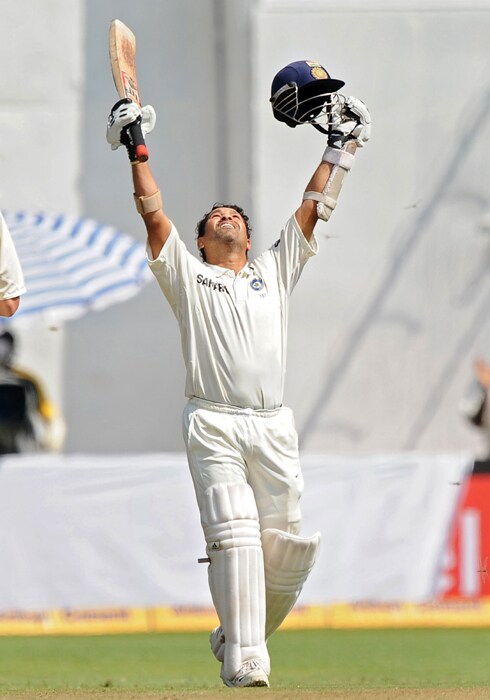 Sachin Tendulkar celebrates his double century during the fourth day of the second Test between India and Australia at M.Chinnaswamy Stadium in Bangalore. (AFP Photo) IND vs AUS: 2nd Test, Day 4