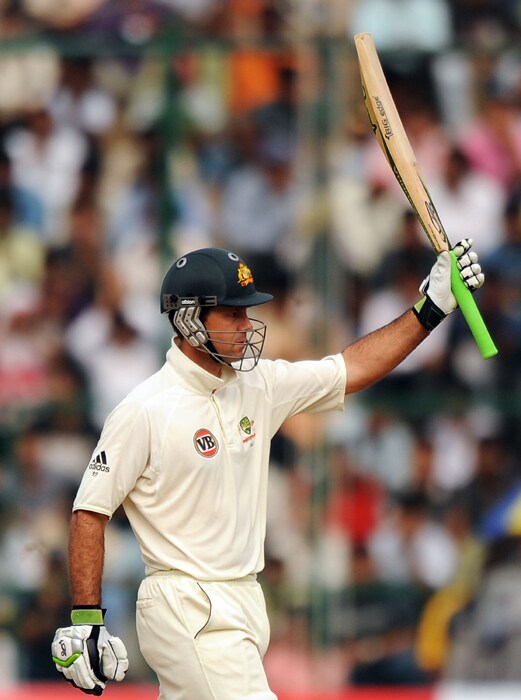 Ricky Ponting celebrates his half-century during the fourth day of the second Test between India and Australia at M.Chinnaswamy Stadium in Bangalore. (AFP Photo) IND vs AUS: 2nd Test, Day 4