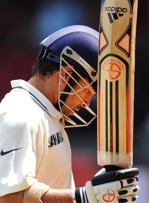 Sachin Tendulkar reacts as he walks back to the dressing room after loosing his wicket during the fourth day of the second Test between India and Australia at M.Chinnaswamy Stadium in Bangalore. (AFP Photo) IND vs AUS: 2nd Test, Day 4