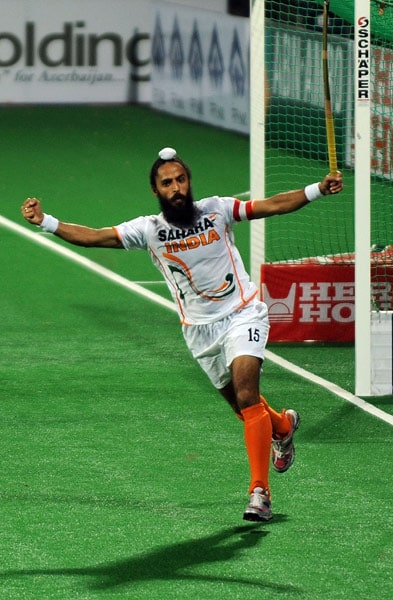 Indian hockey captain Rajpal Singh celebrates scoring a goal during their World Cup 2010 match against England at the Major Dhyan Chand Stadium in New Delhi. (AFP Photo) Unbeaten England enter semis