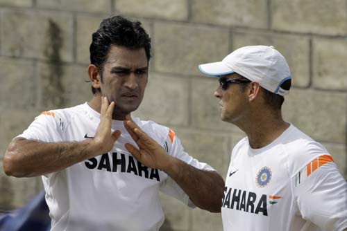 Mahendra Singh Dhoni listens to coach Gary Kirsten during a training session at Beausejour cricket ground in Gros-Islet, St. Lucia on Wednesday. India will face the West Indies in the third one-day international on Friday, with the four-match series leveled 1-1. (AP Photo) India prepare for 3rd ODI