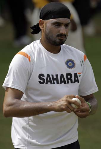 Harbhajan Singh prepares to bowl in the nets during a training session at Beausejour ground in Gros-Islet. (AP Photo) India prepare for 3rd ODI