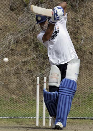 Mahendra Singh Dhoni bats in the nets during a training session at Beausejour ground in Gros-Islet. (AP Photo) India prepare for 3rd ODI