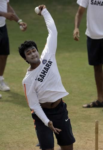 Pragyan Ojha bowls in the nets during a training session at Beausejour ground in Gros-Islet. (AP Photo) India prepare for 3rd ODI