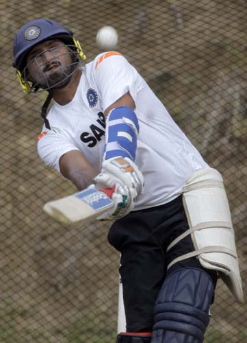 Harbhajan Singh bats in the nets during a training session at Beausejour ground in Gros-Islet. (AP Photo) India prepare for 3rd ODI