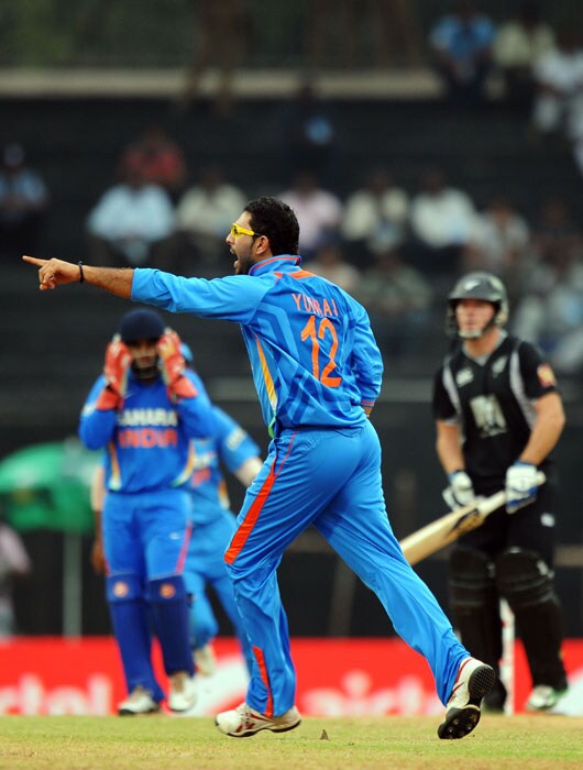 Yuvraj Singh celebrates the wicket of Jamie How during the final ODI between India and New Zealand in Chennai. (AFP Photo) India sweep series 5-0
