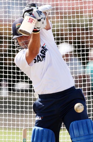Sachin Tendulkar drives a ball in nets at Napier. India is preparing for their first one-day match against New Zealand to be played on March 3. (AFP Photo) Team India net session at Napier