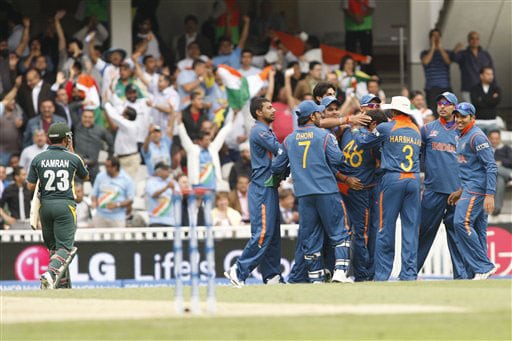 Indian players celebrate the wicket of Kamran Akmal during their Twenty20 World Championship warm-up match at the Oval in London. (AP Photo) Ind vs Pak warm-up match