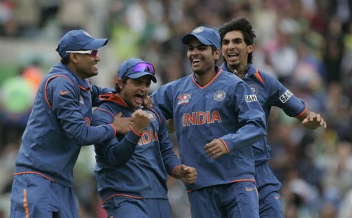 Suresh Raina celebrates with teammates after running out Ahmad Shehzad in their warm up match for the Twenty20 World Championship at the Oval in London. (AP Photo) Ind vs Pak warm-up match