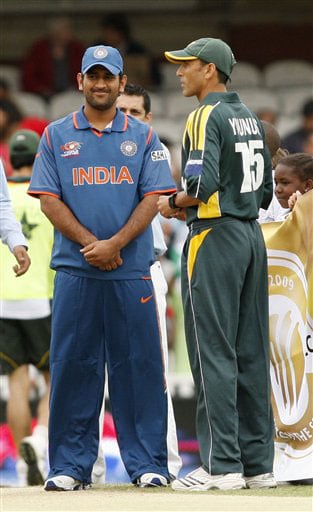 India captain Mahendra Singh Dhoni and Pakistan captain Younis Khan wait for the toss before the start of their Twenty20 World Championship warm-up match at the Oval in London. (AP Photo) Ind vs Pak warm-up match