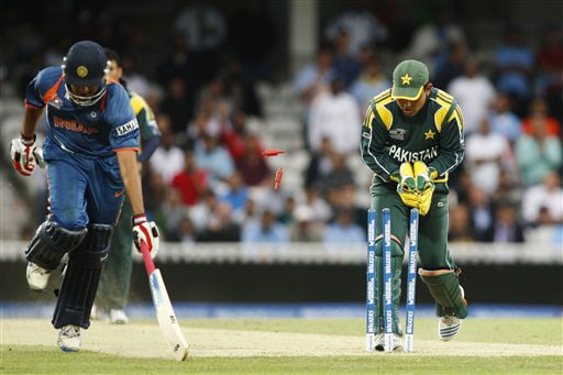 Rohit Sharma runs in safely as wicketkeeper Kamran Akmal hits the wicket during their Twenty20 World Championship warm-up match at the Oval in London. (AP Photo) Ind vs Pak warm-up match