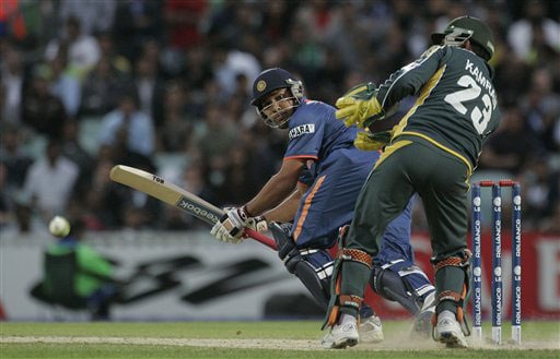 Kamran Akmal looks on as Rohit Sharma scores four runs in their warm up match for the Twenty20 World Championship at the Oval in London. (AP Photo) Ind vs Pak warm-up match
