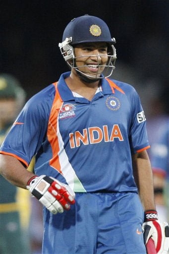 Rohit Sharma reacts to his half-century after playing a shot off the bowling of Saeed Ajmal during their Twenty20 World Championship warm-up match at the Oval in London. (AP Photo) Ind vs Pak warm-up match