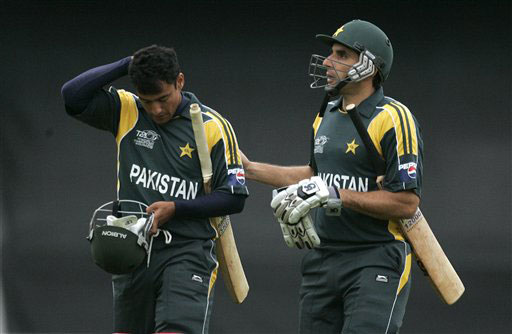Misbah-ul-Haq walks off the pitch with Yasir Arafat at the end of their innings against India in their warm up match for the Twenty20 World Championship at the Oval in London. (AP Photo) Ind vs Pak warm-up match