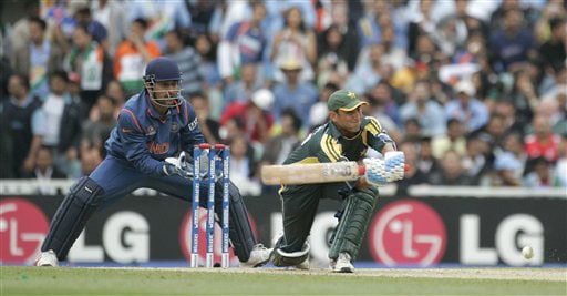 Younis Khan hits out as wicketkeeper Mahendra Singh Dhoni looks on in their warm up match for the Twenty20 World Championship at the Oval in London. (AP Photo) Ind vs Pak warm-up match