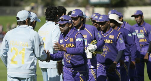 DPMD Jayawardene, front on right side, and his team congratulates India's cricketers after they won the tri-Series One-Day International match in Hobart on Tuesday, February 26, 2008. India won the match by seven wickets. 11th match - India vs Sri Lanka