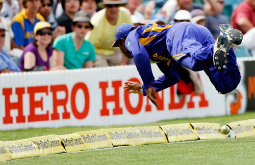 Sri Lankan fieldsman Chamara Kupugedera is airborne as he stops the ball during their One-Day cricket international against India in Canberra on Tuesday, February 12, 2008. 5th Match: India vs Sri Lanka
