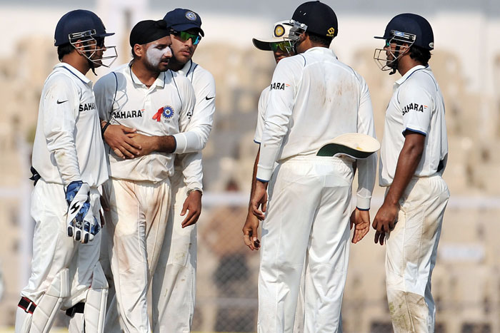 Yuvraj Singh congratulates teammate Harbhajan Singh for the wicket of Tillakaratne Dilshan on the first day of the third Test between India and Sri Lanka in Mumbai. (AFP Photo) India vs SL: 3rd Test, Day 1