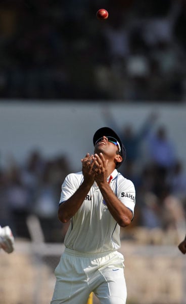 Rahul Dravid celebrates after taking the catch for the wicket of Tharanga Paranavitana on the first day of the third Test between India and Sri Lanka in Mumbai. (AFP Photo) India vs SL: 3rd Test, Day 1