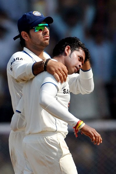 Yuvraj Singh congratulates teammate S Sreesanth for the wicket of Mahela Jayawardene on the first day of the third Test between India and Sri Lanka in Mumbai. (AFP Photo) India vs SL: 3rd Test, Day 1