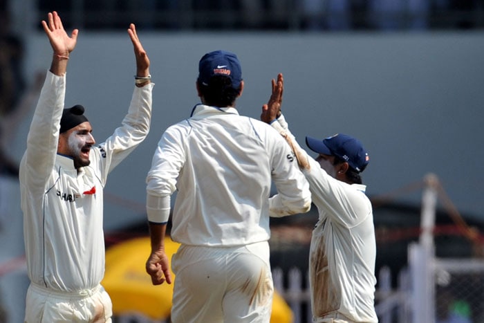 Harbhajan Singh celebrates the wicket of Thilan Samaraweera on the first day of the third Test between India and Sri Lanka in Mumbai. (AFP Photo) India vs SL: 3rd Test, Day 1