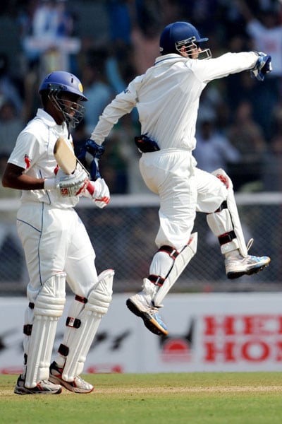 Mahendra Singh Dhoni celebrates the wicket of Thilan Samaraweera on the first day of the third Test between India and Sri Lanka and Mumbai. (AFP Photo) India vs SL: 3rd Test, Day 1
