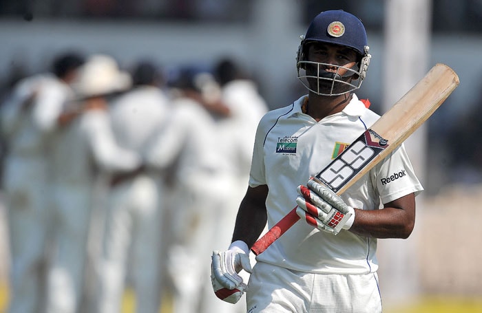 Tharanga Paranavitana walks back after losing his wicket with a score of 50 runs on the first day of the third Test between India and Sri Lanka in Mumbai. (AFP Photo) India vs SL: 3rd Test, Day 1