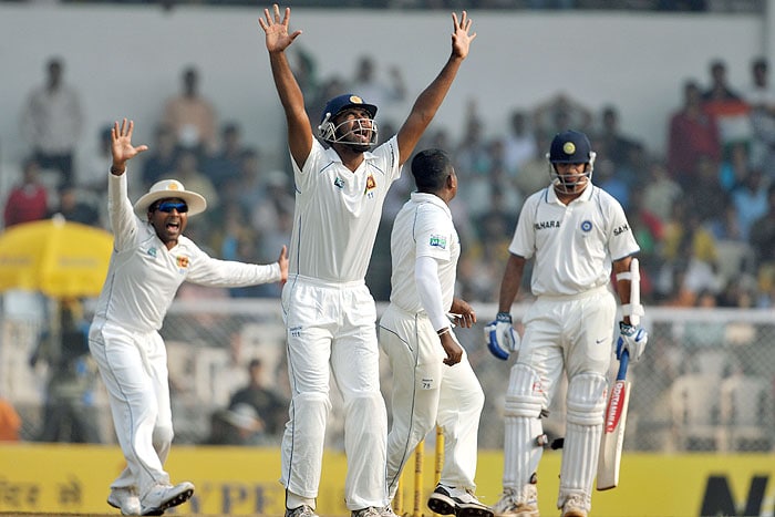Sri Lanka's Tharanga Paranavitana and teammates make an unsuccessful appeal for the wicket of India's Rahul Dravid during third day of the third Test match in Mumbai on Friday. (AFP Photo) India vs SL: 3rd Test, Day 3