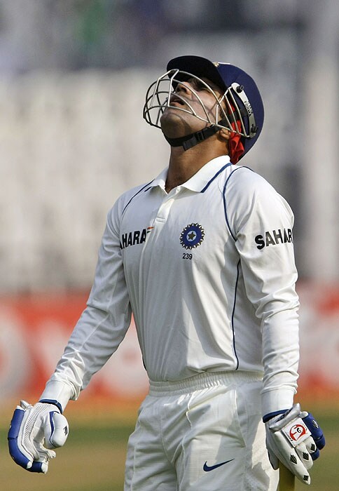 India's Virender Sehwag reacts after his dismissal on the third day of the third Test against Sri Lanka on Friday. (AP Photo) India vs SL: 3rd Test, Day 3
