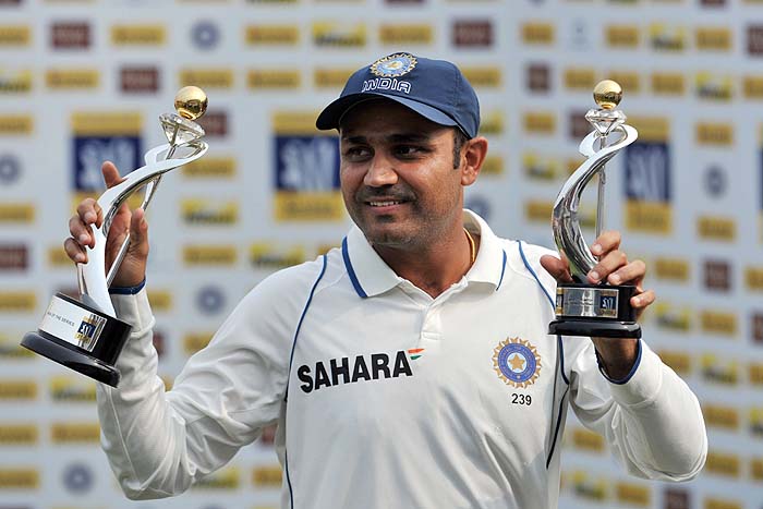 India's Virendra Sehwag shows the "Man of the match" and "Man of the series" trophies after his team won on the final day of the third Test against Sri Lanka in Mumbai on Sunday. (AFP Photo) Men in Blue on top of the world