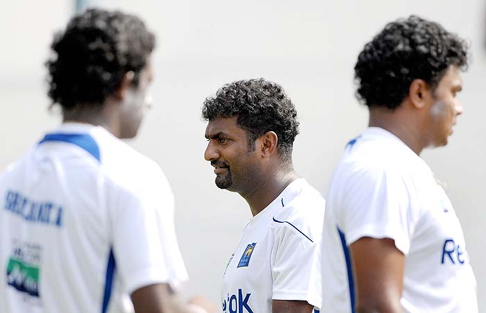 Sri Lankan cricketers Ajantha Mendis, Muttiah Muralitharan and Thilina Kandamby prepare to bowl in the nets during a training session on the eve of the first Test against India at the Motera stadium in Ahmedabad on Sunday, November 15, 2009. Sri Lanka's hopes of winning their first ever Test on Indian soil were given a huge lift when Tillakaratne Dilshan was declared fit to play after an ankle injury. (AFP Photo) India, Lanka gear up for Tests