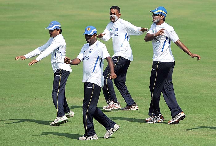 Sri Lanka's Prasanna Jayawardene, Muttiah Muralitharan, Thilan Samaraweera and Kumar Sangakkara stretch during a training session on the eve of the first Test against India in Ahmedabad on Sunday. (AFP Photo) India, Lanka gear up for Tests