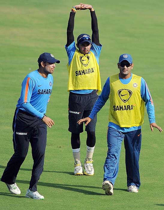 India's VVS Laxman, Shanthakumaran Sreesanth and MS Dhoni interact during a training session on the eve of the first Test against Sri Lanka in Ahmedabad on Sunday. (AFP Photo) India, Lanka gear up for Tests