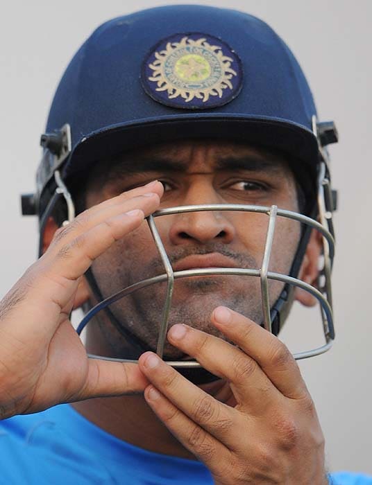 India's MS Dhoni takes off his protective helmet during a training session at the nets in Ahmedabad on Sunday. (AFP Photo) India, Lanka gear up for Tests