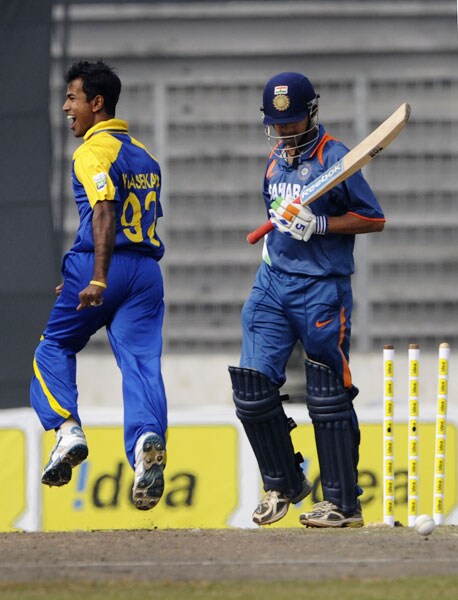 Nuwan Kulasekara celebrates the wicket of Gautam Gambhir during the tri-series final between India and Sri Lanka at the Sher-e Bangla National Stadium in Dhaka. (AFP Photo) Tri-series Final: India vs SL