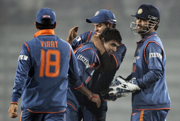 Indian players react with fellow team member Ravindra Jadeja after dismissing Thilan Samaraweera during the tri-series final between India and Sri Lanka at the Sher-e Bangla National Stadium in Dhaka. (AP Photo) Tri-series Final: India vs SL