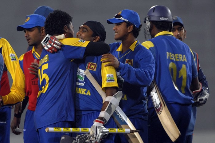 Mahela Jayawardene hugs teammates after winning the tri-series final against India to lift the IDEA Cup at the Sher-e Bangla National Stadium in Dhaka. (AFP Photo) Tri-series Final: India vs SL