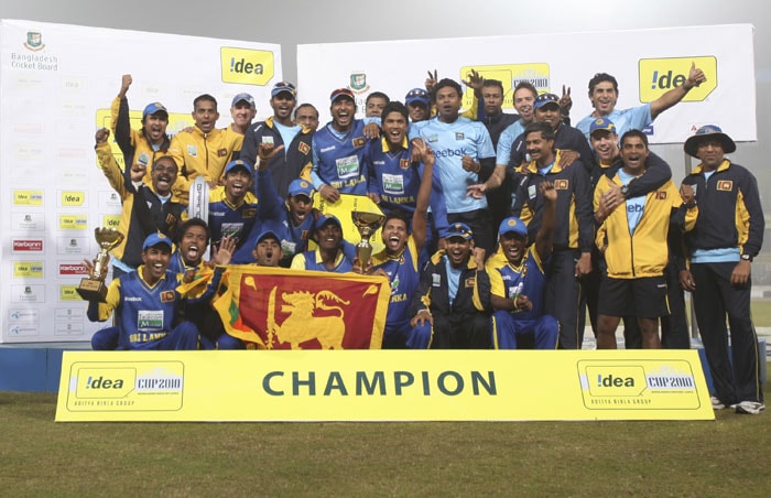 Sri Lankan players and team support staff pose with the trophy after their win against India in the final ODI of the tri-series in Dhaka. (AP Photo) Tri-series Final: India vs SL