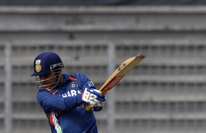 Virender Sehwag plays a shot during the tri-series final between India and Sri Lanka at the Sher-e Bangla National Stadium in Dhaka. (AFP Photo) Tri-series Final: India vs SL
