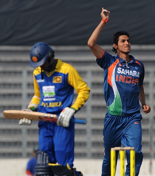 Sudeep Tyagi celebrates the dismissal of Upul Tharanga during the fifth ODI of the tri-nation tournament in Dhaka. (AFP Photo) 5th ODI: India vs SL