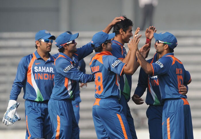 Indian cricketers congratulate teammate Sudeep Tyagi during the fifth ODI of the tri-nation tournament in Dhaka. (AFP Photo) 5th ODI: India vs SL