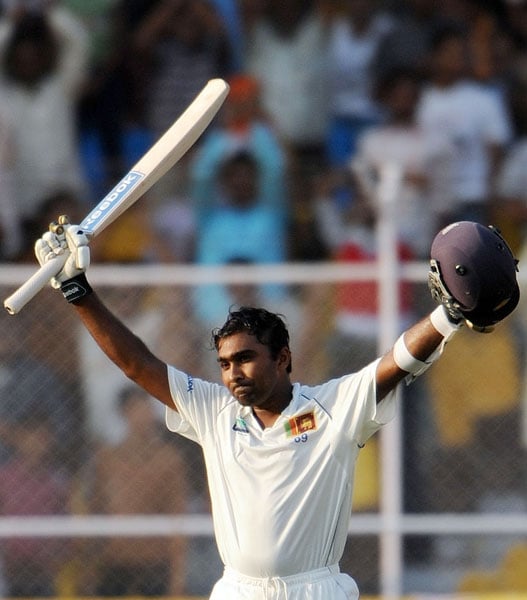 Mahela Jayawardene raises his bat after reaching his double century during the third day of the first Test match between India and Sri Lanka at the Motera stadium in Ahmedabad. (AFP Photo) India vs SL: 1st Test, Day 3