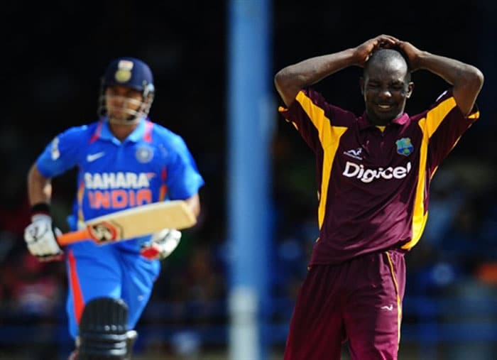 Anthony Martin reacts as Suresh Raina scores a run during the first ODI between West Indies and India at the Queen's Park Oval in Port of Spain. (AFP Photo) 1st ODI: India vs West Indies