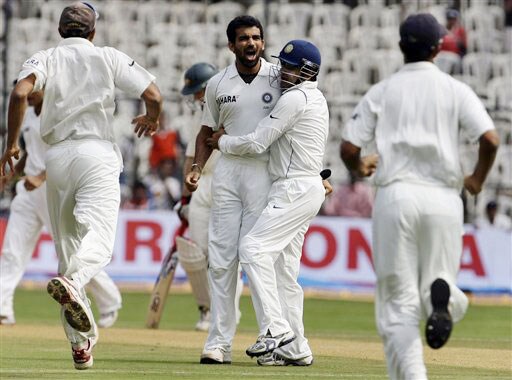 Indian players run in to congratulate bowler Zaheer Khan after he took the wicket of Matthew Hayden on the first day of the first Test between India and Australia in Bangalore. India vs Australia: 1st Test, Day 1