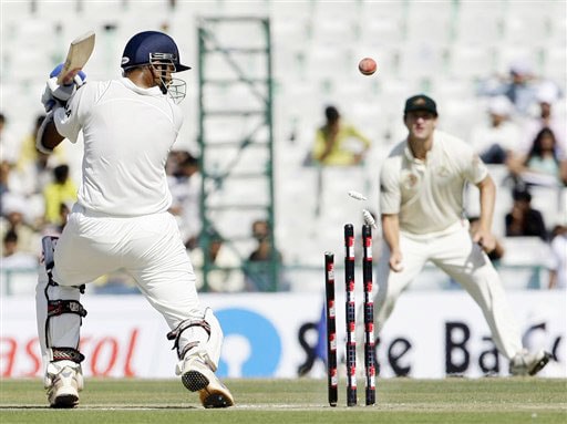 The bails fly off the wicket to dismiss Rahul Dravid on the first day of the second Test against Australia in Mohali. India vs Australia: 2nd Test, Day 1