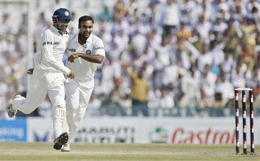 Gautam Gambhir and Amit Mishra run towards the stumps to take them as a trophy after defeating Australia on the final day of the second Test between India and Australia in Mohali. India vs Australia: 2nd Test, Day 5